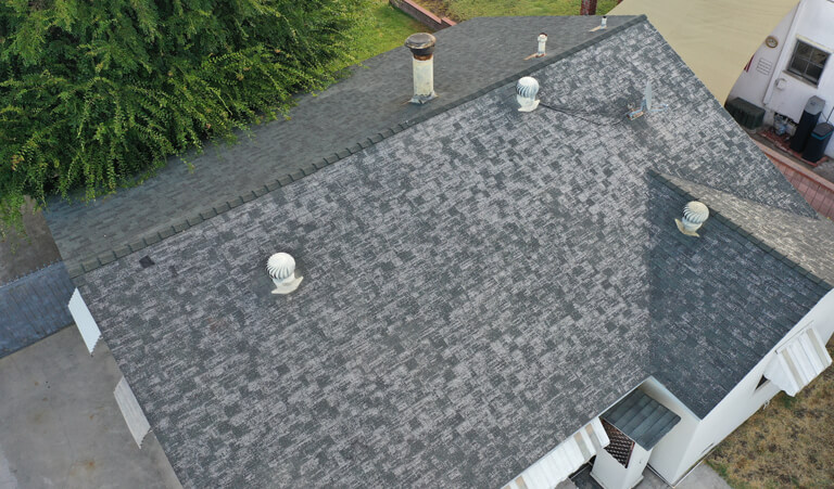 A roof with many different types of shingles.