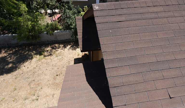 A brown roof with a hole in it